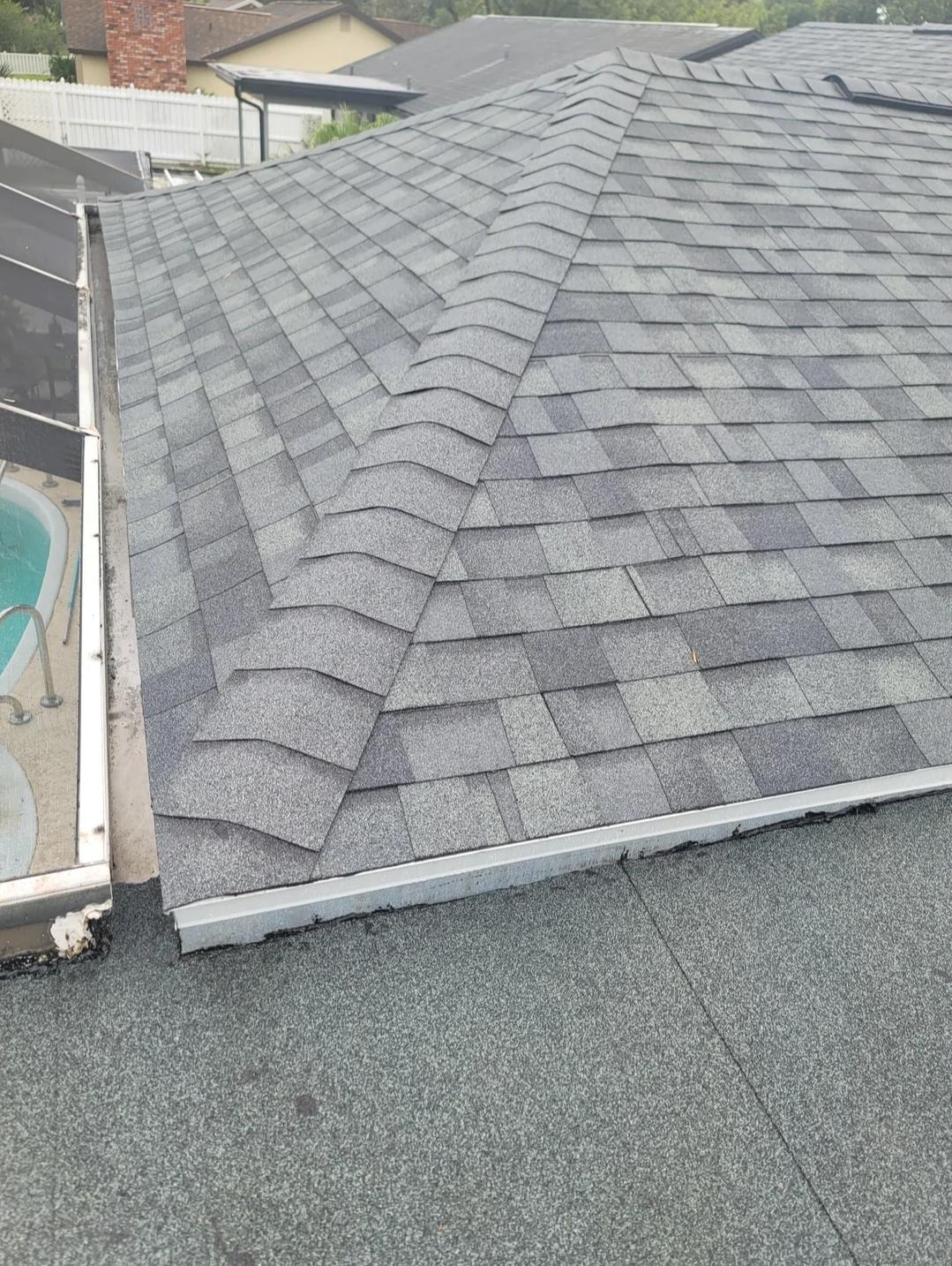 Close view of completed residential asphalt shingle roofing